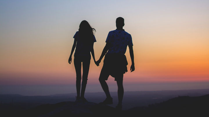 silhouetted couple at dusk