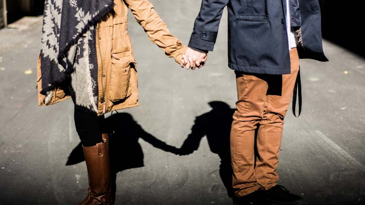 a couple holding hands