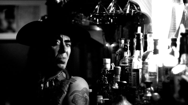 A man next to liquor