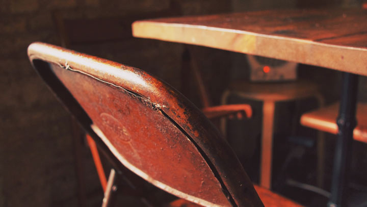 chair's back next to a table