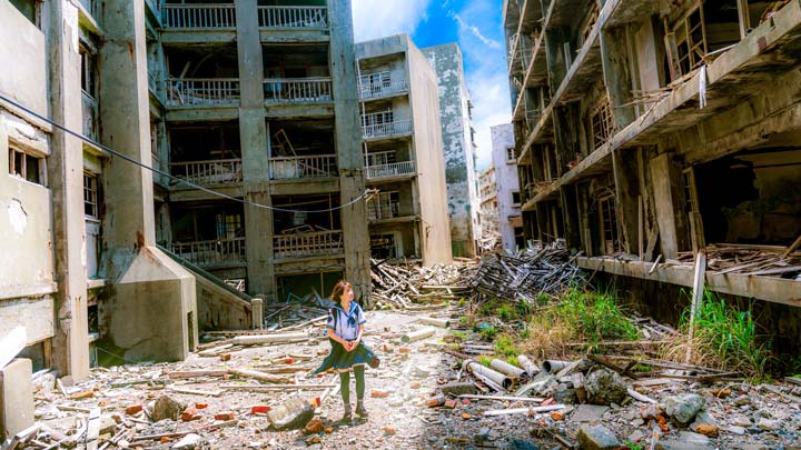 a woman in a war torn street