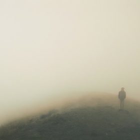 a person in a foggy landscape