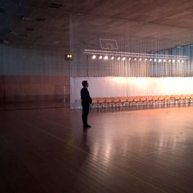 a man in a large empty hall