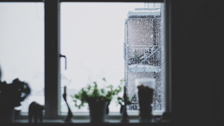 snow outside a window - imagery for "First & Last" by Ingrid Bruck