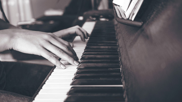 playing a piano - imagery for "Contrapuntal" by J.A. Pak