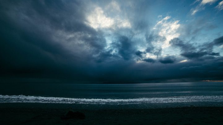 Beach under dark clouds, image for Part I by Josey Rose Duncan