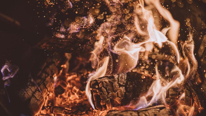 burning wood, image for After the Second Miscarriage by Marybeth Rua-Larsen
