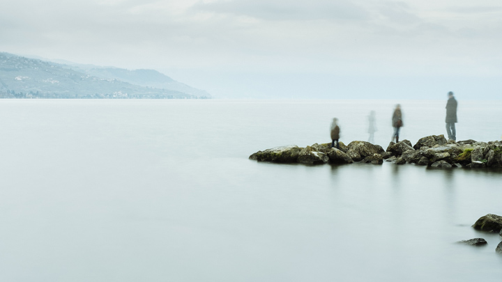 Vague figures at water's edge, image for Saltwater Tea by Thomas O’Connell