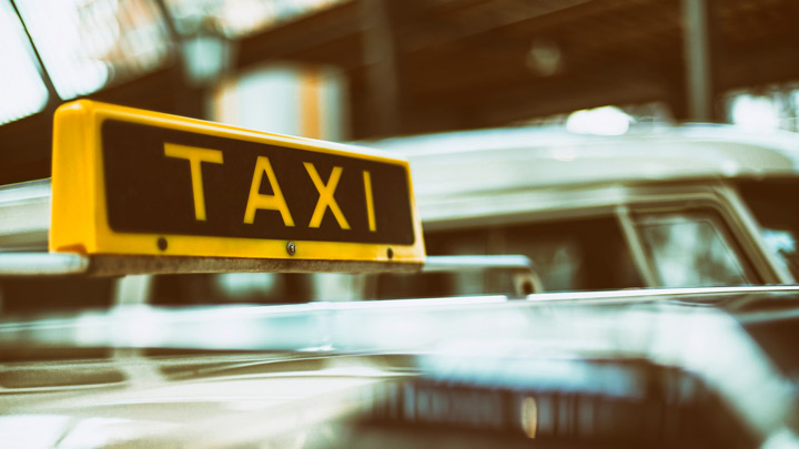 rooftop taxi sign, image for Wrong Turns by Kyle Hemmings