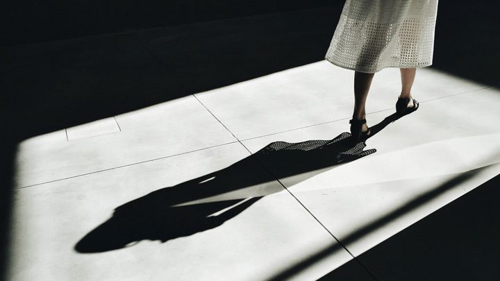 a woman's shadow, image for Division by Mark Renney