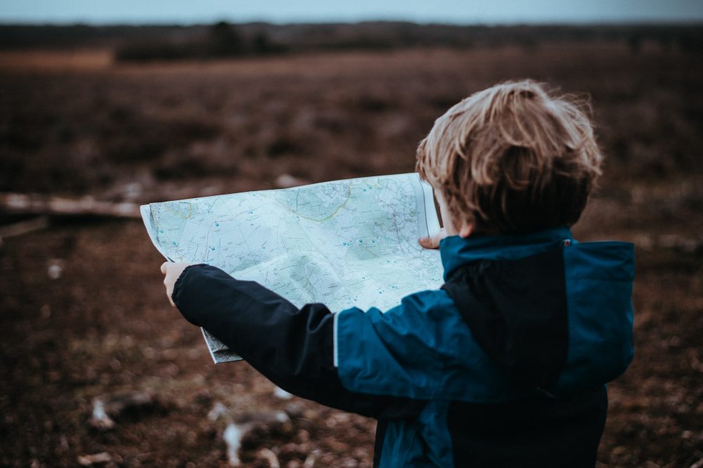 viewing a map, image for "Mapping" by Erika Eckart