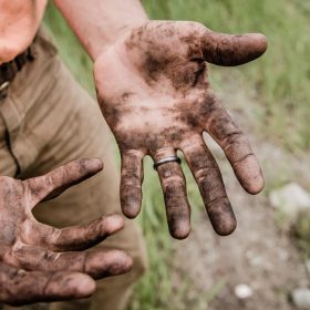 muddy hands image for "The Way We Should All Go" by Jack Caseros