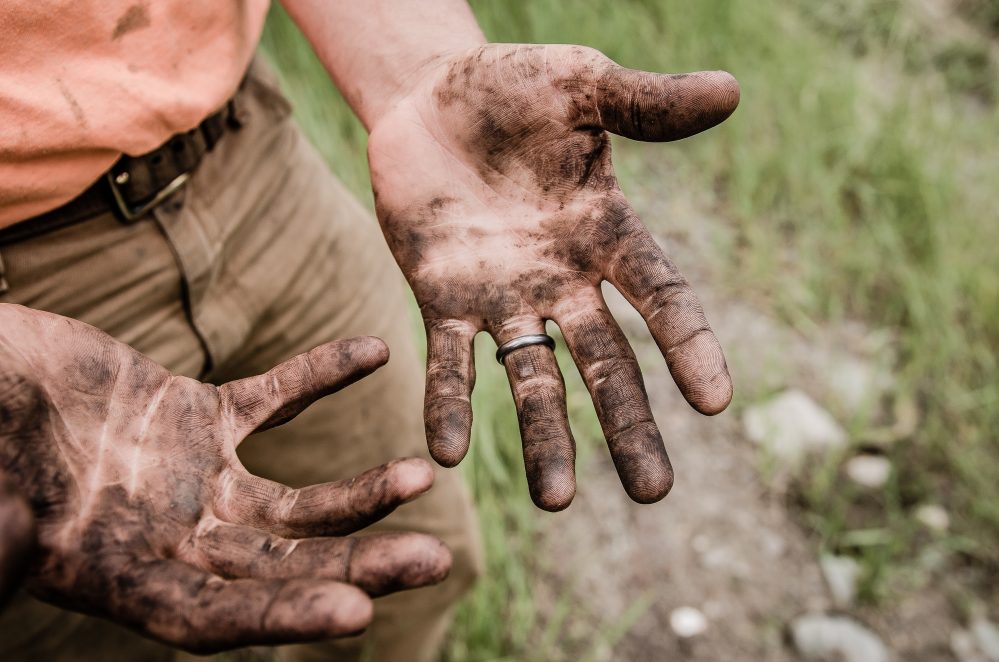 muddy hands image for "The Way We Should All Go" by Jack Caseros