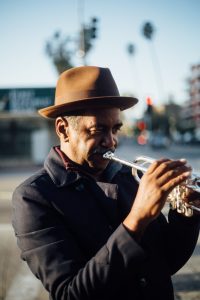 photo of man playing trumpet